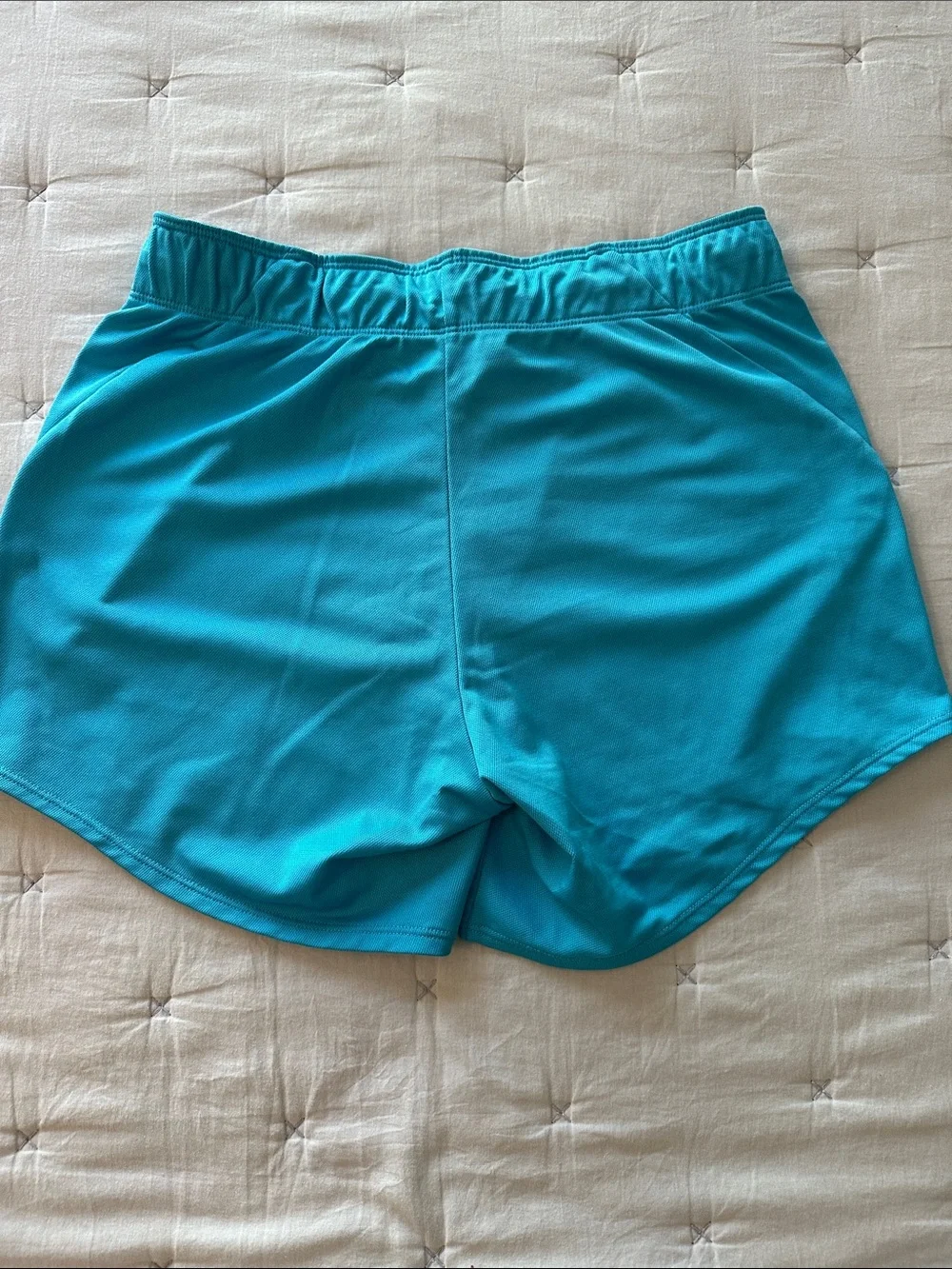 Nike Turquoise Performance Shorts with White Swoosh